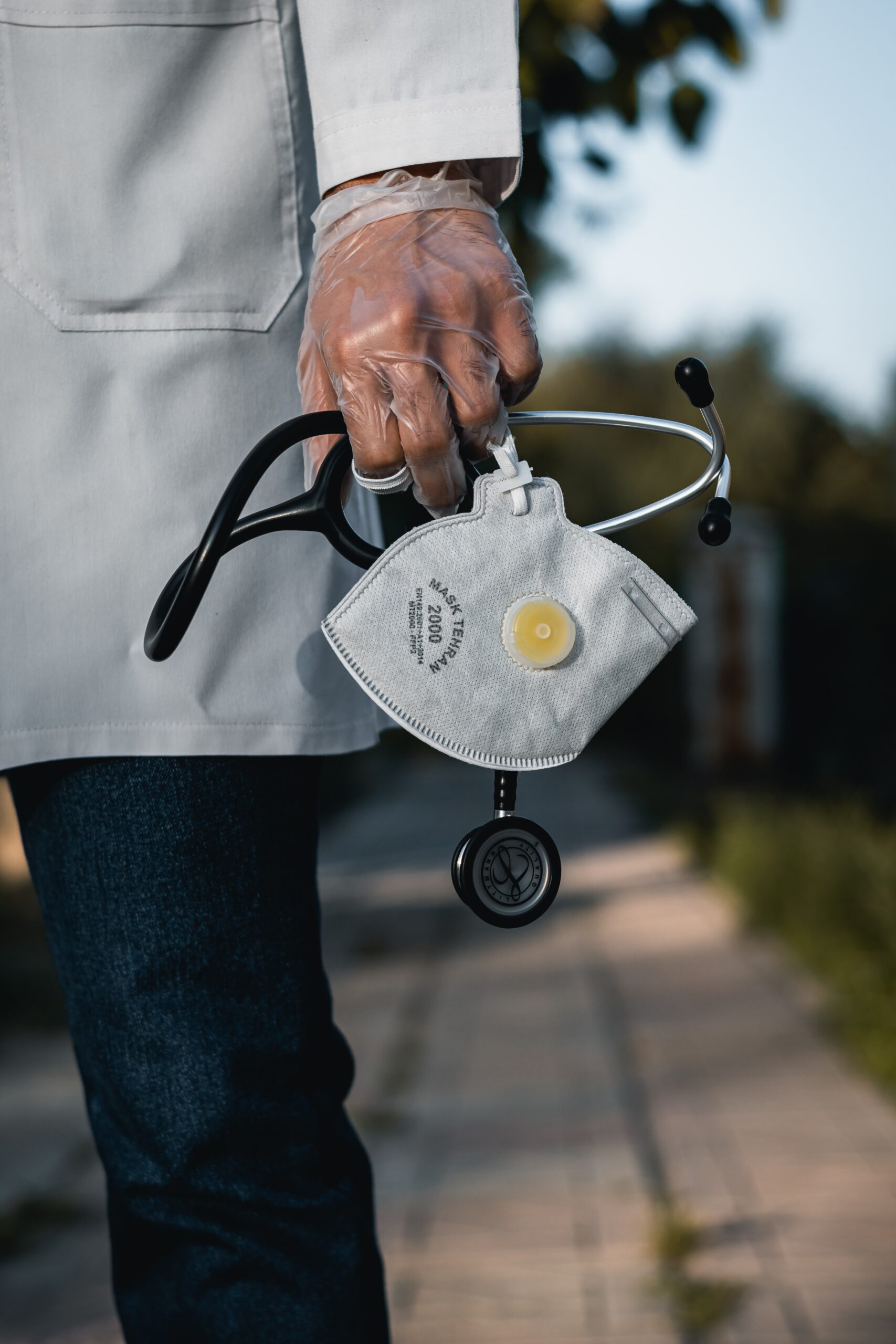 Picture of Doctor holding stethoscope and N95 mask