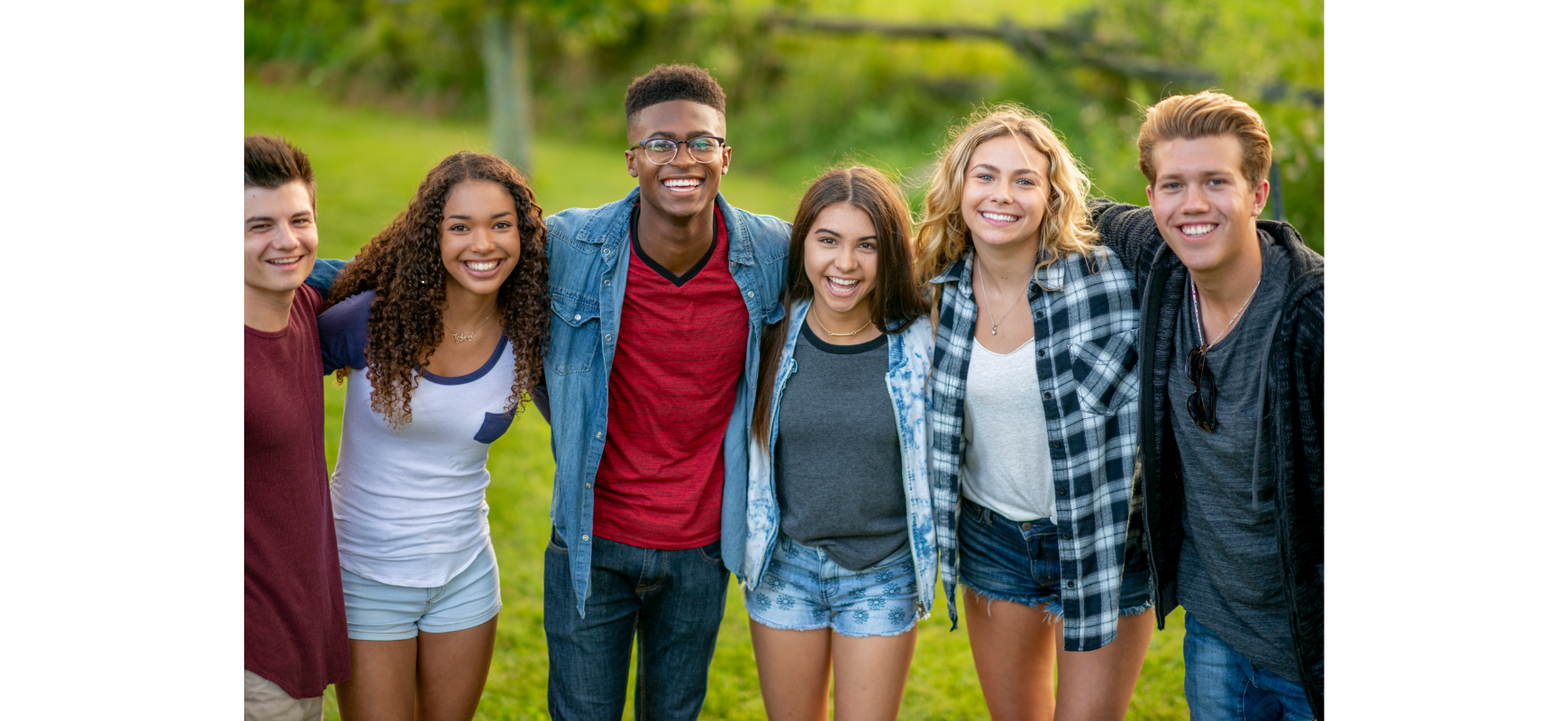 Teenage friends smiling together outdoors